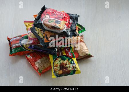 KYIV, UKRAINE - OCTOBER 31, 2023 Many packs of instant noodles for fast cooking by various brands and manufacturers close up Stock Photo