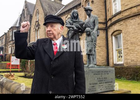 Barnsley, UK. 09 MAR, 2024. Arthur Scargill, British trade unionist and Miners strike leader,  stands statue memorial to fallen miners outside the National Union of Mineworkers hall in Barnsley. This is ahead of the 40th Aniversary of the Miners strikes. Credit Milo Chandler/Alamy Live News Stock Photo