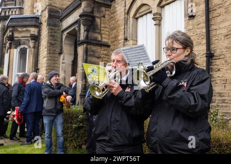Barnsley, UK. 09 MAR, 2024. Musicians from the Maltby colliery play a somber note in preperation for wreathlaying outside the NUM hall in Barnsley . Credit Milo Chandler/Alamy Live News Stock Photo