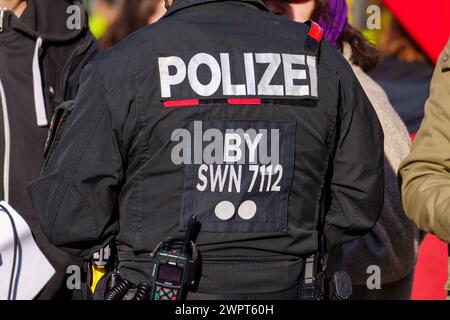 Augsburg, Bavaria, Germany - March 8, 2024: Police officer in riot police uniform at a demonstration *** Polizist in Uniform der Bereitschaftspolizei bei einer Demonstration Stock Photo
