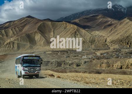 Local bus on unpaved road, Kingdom of Mustang, Nepal Stock Photo