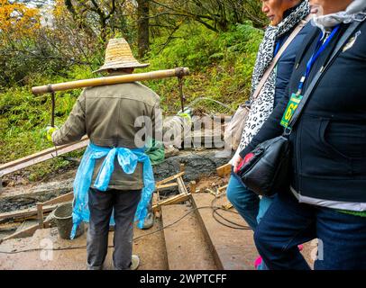 EMEISHAN, China, Group People, Chinese Migrant Workers, Men Laborers Working on Construction Site, Walking at Historic Site, Behind Stock Photo