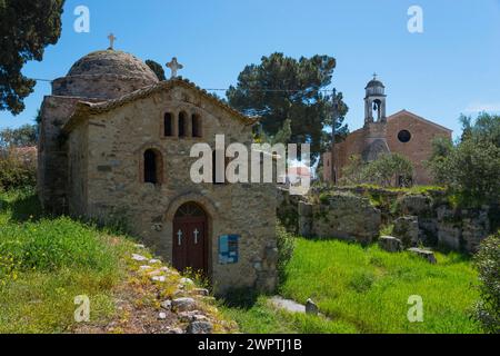 Ancient stone church surrounded by trees and vegetation, Temple of Apollo of ancient Assinai, Byzantine fortress, nunnery, monastery, Koroni Stock Photo
