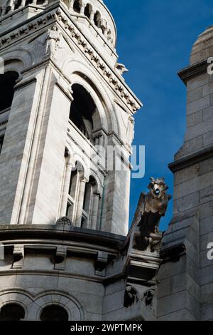 Stone Griffin  Gargoyle On The Side Of The Campanille, Bell Tower, Basilica Sacre Coeur De Montmartre, Paris Stock Photo