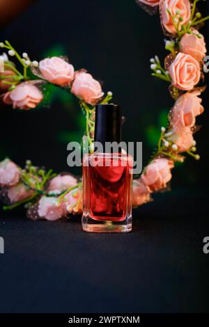 Said View of The Pink Color Rose Flowers and nail polish on pink rose petals on Black Background Stock Photo
