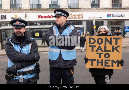 Manchester, UK. 09th Mar, 2024. Placrad with dont talk to them. Protesters Including Members Of The Jewish Community Protest Against The Conflict In Gaza Today Manchester City Centre. The protest included protesters blind folding themselves outside Barclays Bank on Market street. Manchester. UK.  Picture: Garyroberts/worldwidefeatures. Credit: GaryRobertsphotography/Alamy Live News Stock Photo