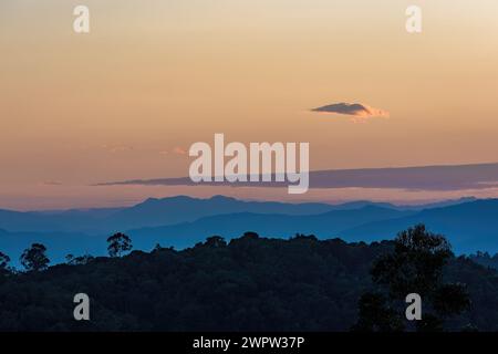 A very little cloud floats at the horizon, in a beautiful dusk over the eastern Andean mountains of central Colombia. Stock Photo