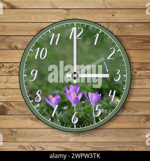 The clock shows the hand moving forward from 2 a.m. in winter to 3 a.m. in spring. Daylight saving time. The transition of time, the change of time, t Stock Photo