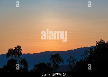 Some singular waved clouds in a sunset, over the eastern Andean mountains of central Colombia. Stock Photo