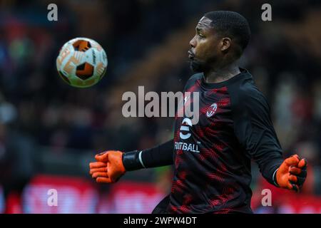 Mike Maignan of AC Milan warms up during Round of 16 . Leg 1 of 2 UEFA Europa League 2023/2024 between AC Milan and SK Slavia Praha at San Siro Stadium. Final score; Milan 4:2 Slavia Praha. Stock Photo