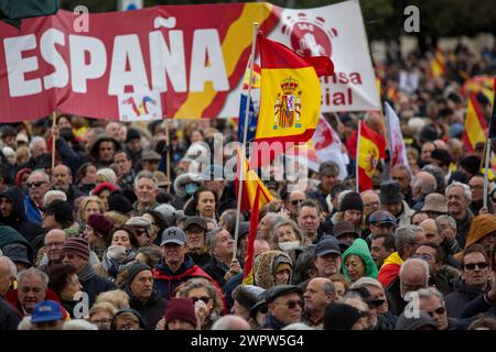 Madrid, Spain. 09th Mar, 2024. Protesters hold Spanish flags during a rally organized by the Freedom and Alternative Forum under the motto 'There are plenty of reasons: Sánchez resigns.' Hundreds of people with Spanish flags gathered in the Plaza de Cibeles in the Center of Madrid, to protest against the plans of the Spanish Government led by Pedro Sanches, to give amnesty to those linked to the referemdum in Catalonia in 2017. Credit: SOPA Images Limited/Alamy Live News Stock Photo