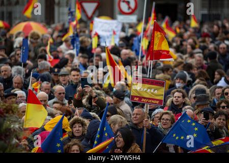 Madrid, Spain. 09th Mar, 2024. Protesters hold Spanish flags during a rally organized by the Freedom and Alternative Forum under the motto 'There are plenty of reasons: Sánchez resigns.' Hundreds of people with Spanish flags gathered in the Plaza de Cibeles in the Center of Madrid, to protest against the plans of the Spanish Government led by Pedro Sanches, to give amnesty to those linked to the referemdum in Catalonia in 2017. Credit: SOPA Images Limited/Alamy Live News Stock Photo