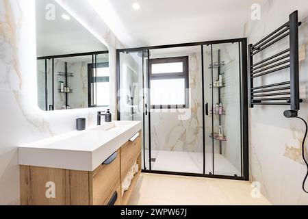 an image of a newly fitted luxury standing shower bathroom in luxury mediterranean apartment Stock Photo