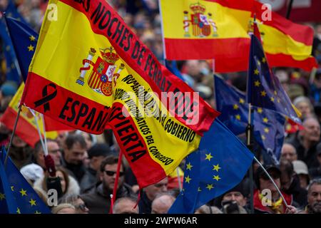 Madrid, Spain. 09th Mar, 2024. Protesters hold Spanish flags during a rally organized by the Freedom and Alternative Forum under the motto 'There are plenty of reasons: Sánchez resigns.' Hundreds of people with Spanish flags gathered in the Plaza de Cibeles in the Center of Madrid, to protest against the plans of the Spanish Government led by Pedro Sanches, to give amnesty to those linked to the referemdum in Catalonia in 2017. (Photo by Luis Soto/SOPA Images/Sipa USA) Credit: Sipa USA/Alamy Live News Stock Photo