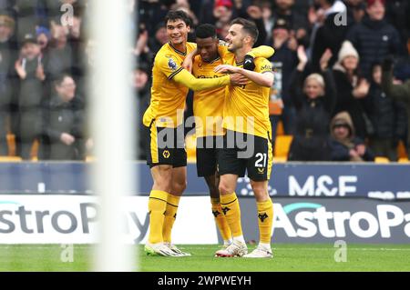 Wolverhampton, UK. 9th Mar, 2024. Nelson Semedo of Wolverhampton Wanderers celebrates with Nathan Fraser and Pablo Sarabia after scoring their team's second goal during the Premier League match at Molineux, Wolverhampton. Picture credit should read: Cameron Smith/Sportimage Credit: Sportimage Ltd/Alamy Live News Stock Photo