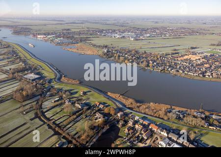 Aerial view flying above Dutch river Lek near Rotterdam with view at village Schoonhoven Stock Photo