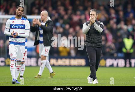 LONDON, ENGLAND - MARCH 9: Chris Willock of Queens Park Rangers and Martí Cifuentes, manager of Queens Park Rangers clapping the fans after the Sky Bet Championship match between Queens Park Rangers and Middlesbrough at Loftus Road on March 9, 2024 in London, England.(Photo by Dylan Hepworth/MB Media) Stock Photo