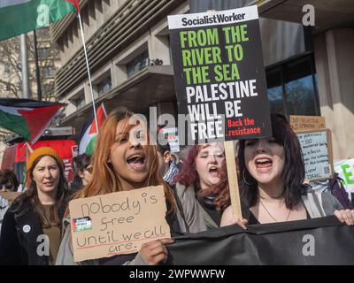 London, UK. 9 Mar 2024. 'Nobody is free until we all are.:. A huge peaceful march to the US Embassy demands a full ceasefire in Gaza and an end to Israeli genocide. The IDF has now killed over 30,000 people, mainly women and children, continue to ignore the ICJ ruling to avoid genocide and preparing a brutal assault on Rafah. Israel continues to stop the humanitarian aid and medical supplies needed to avoid mass deaths from disease and starvation and spread lies about UNRWA whose funding is essential.  Peter Marshall/Alamy Live News Stock Photo