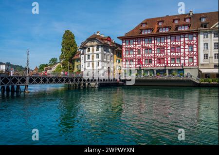Tourists flock to Old Town Lucerne along the promenade Stock Photo