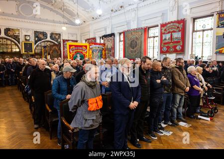 Barnsley, UK. 09 MAR, 2024. Guests gather in the National Union Of Mineworkers hall in Barnsley for remembrance event for Davy Jones and Joe Green and to comemorate the 40th Anniversary of the Miners Strikes. Credit Milo Chandler/Alamy Live News Stock Photo
