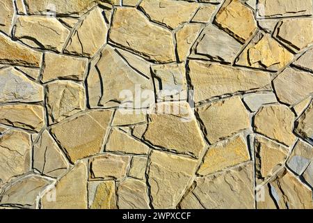 Beige stone blocks in the wall Stock Photo