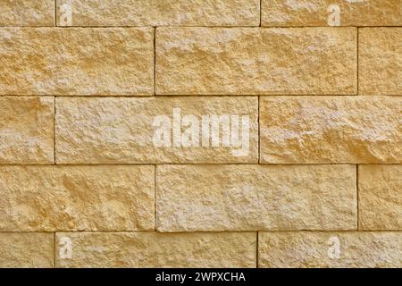 Beige stone blocks in the wall Stock Photo