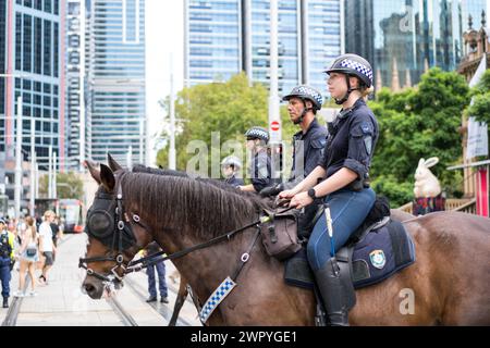 Mounted police monitor demonstrators during a Sydney march supporting Palestinians in the Gaza War. Stock Photo