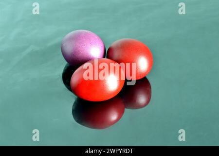 Chicken eggs painted red in honor of Easter. Stock Photo