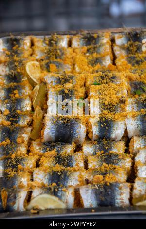 Traditional homemaid sarde a beccafico , sicilian stuffed sardines, in Ballaro market, Palermo, Sicily, Italy Stock Photo