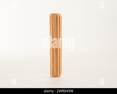 close up of a single Wooden fluted Dowel pinisolated on a white background Stock Photo