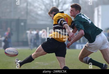 HAWICK V CURRIE, BT CELLNET CUP SEMI FINAL, 30/3/02. Currie's Andy Longley clears as he is tackled by Hawick's Nikkie Walker. Stock Photo