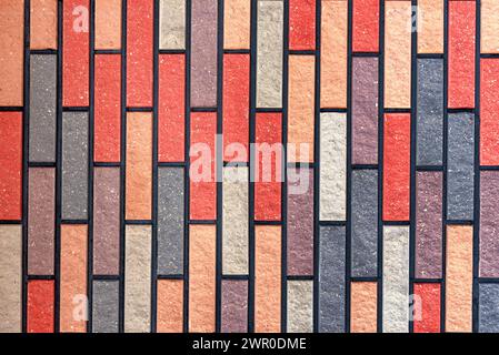 Wall made of multi-colored bricks. Bricks background. Abstract texture Stock Photo