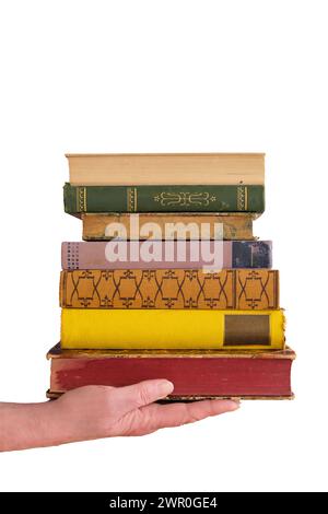 female hand and a stack of books,education,knowledge,library,back to school concept on white background,free copy space Stock Photo