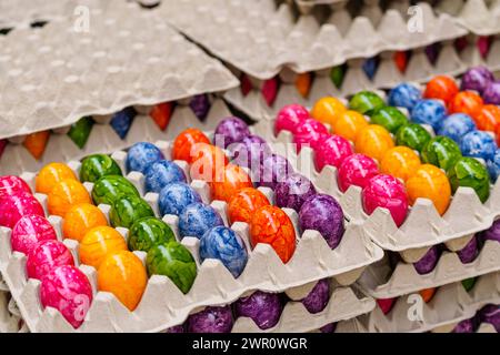 Thannhausen, Bavaria, Germany - 10 March 2024: Colorfully dyed eggs for Easter in industrial production at Eierfärberei Beham in Thannhausen in Bavaria *** Bunt gefärbte Eier zu Ostern in der industriellen Herstellung bei der Eierfärberei Beham in Thannhausen in Bayern Stock Photo