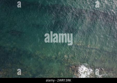 Beautiful green sea water background. Texture of shiny waves Stock Photo