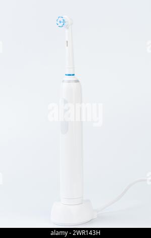 Charging electrical brush with stand isolated on white studio background Stock Photo