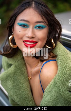 young Asian woman classic car fashion makeup lifestyle relaxing sultry beautiful Stock Photo