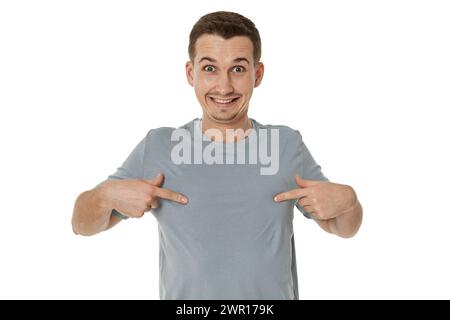 happy guy looking pointing at himself on white studio background Stock Photo