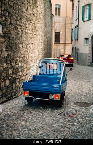 cargo blue motorcycle on a stone-paved road. High quality photo Stock Photo