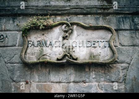 antique sign indicating a pharmacy on a stone house. High quality photo Stock Photo