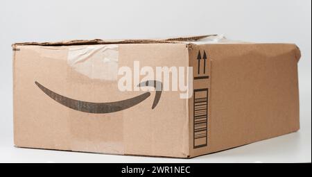 New York, USA - March 9, 2024: Amazon box on white background ready for delivery close up view Stock Photo