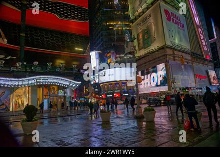 manhattan by night, city lights, crowds, midtown festive lights, yellow cabs, traffic wardens Stock Photo