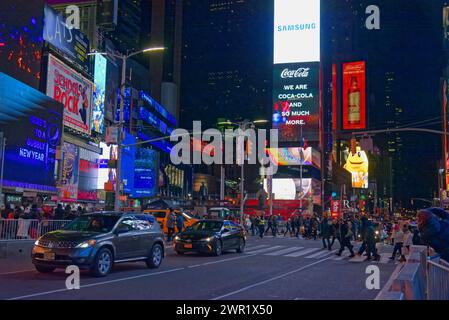 manhattan by night, city lights, crowds, midtown festive lights, yellow cabs, traffic wardens Stock Photo