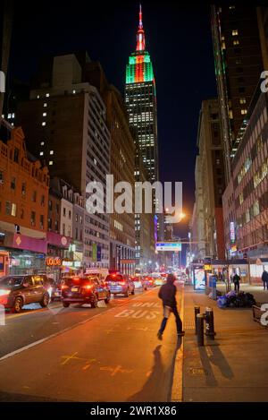 manhattan by night, city lights, crowds, midtown festive lights, yellow cabs, traffic wardens Stock Photo