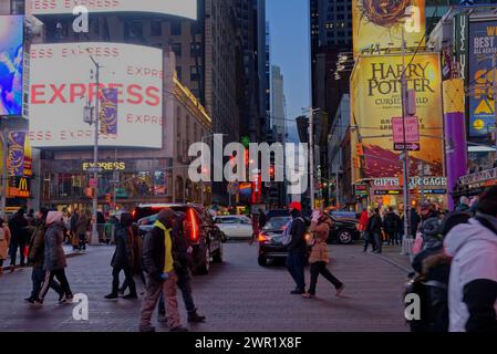 Manhattan by night, city lights, crowds, midtown festive lights, yellow cabs, traffic wardens Stock Photo