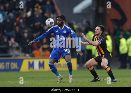 Stephy Mavididi of Leicester City in action with Hull City's Lewis Coyle during the Sky Bet Championship match between Hull City and Leicester City at the MKM Stadium, Kingston upon Hull on Saturday 9th March 2024. (Photo: Mark Fletcher | MI News) Credit: MI News & Sport /Alamy Live News Stock Photo