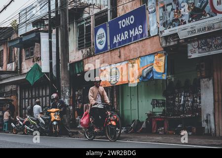 old man is pedaling a bicycle Stock Photo