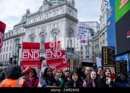 London, UK. 9th Mar, 2024. A crowd of protestors hold placards during the march at the Million Women Rise March. The mission of the organisation is to end male violence towards women and girls, which continues to be a major societal issue in every corner of the globe. Together we can end men violence in all its forms against us! Joined by all women's march in their 18th year, lead by Black/Global Majority Women for all Women and Girls. (Credit Image: © Loredana Sangiuliano/SOPA Images via ZUMA Press Wire) EDITORIAL USAGE ONLY! Not for Commercial USAGE! Stock Photo