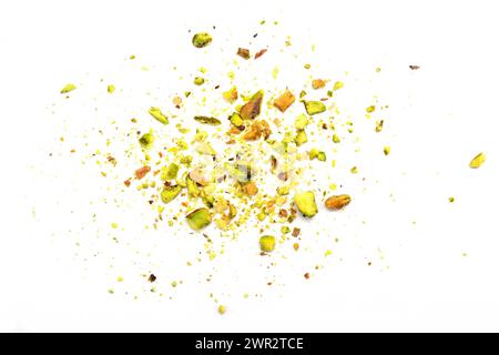 Ground, milled, crushed or granulated pistachio pile isolated on white background Stock Photo