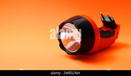 Led light flashlight that recharges with electricity Stock Photo